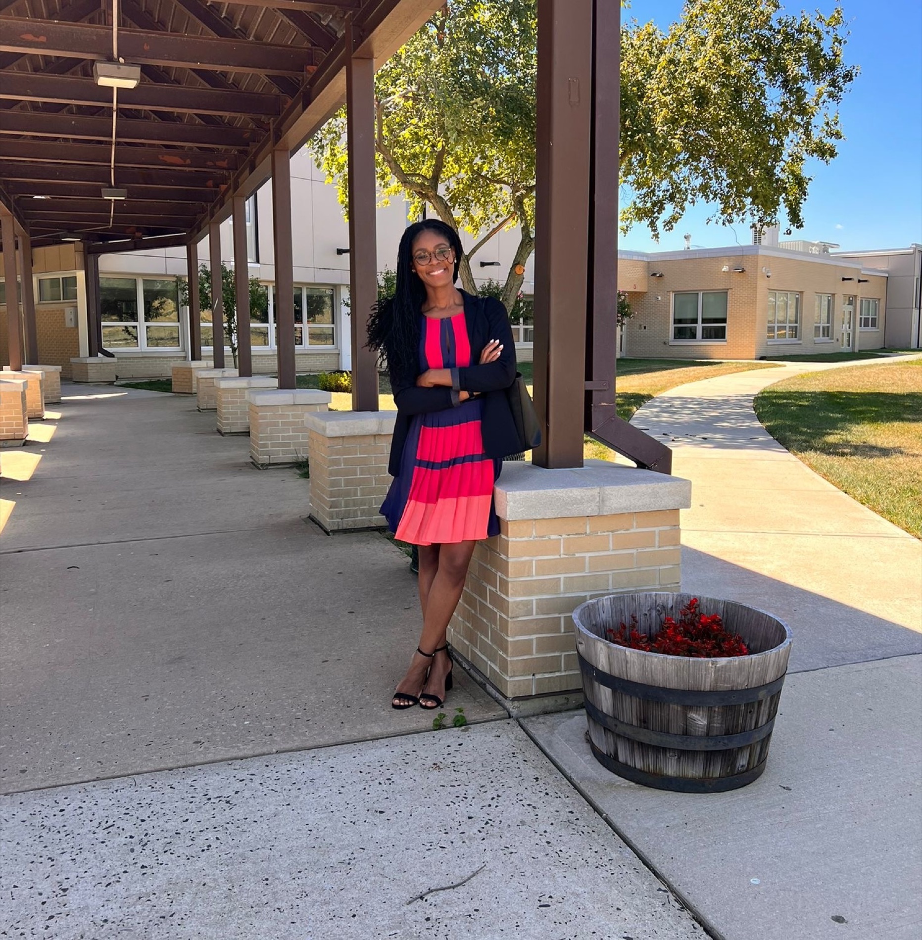 Dr. Jacynth Joyce outside a school